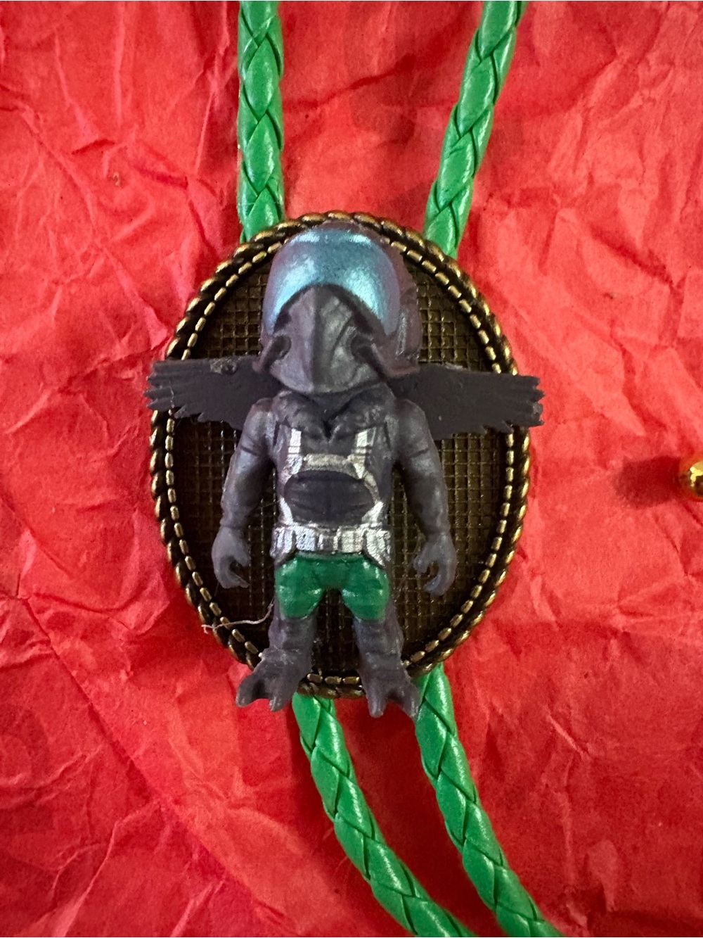 Handcrafted Winged Hooded Figure Bolo Tie in Green and Black